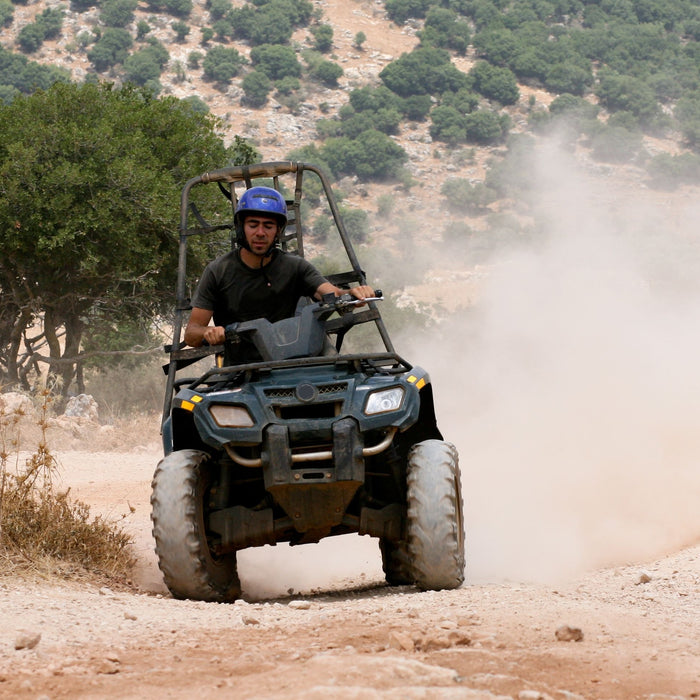 ATV riding on dirt road